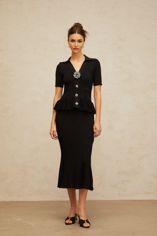 Black midi dress with pointelle knit pattern and embellishments
