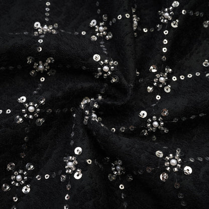 Black sleeveless dress with round neckline rear zipper % shiny crystal embellishments and made of 100% highquality polyester