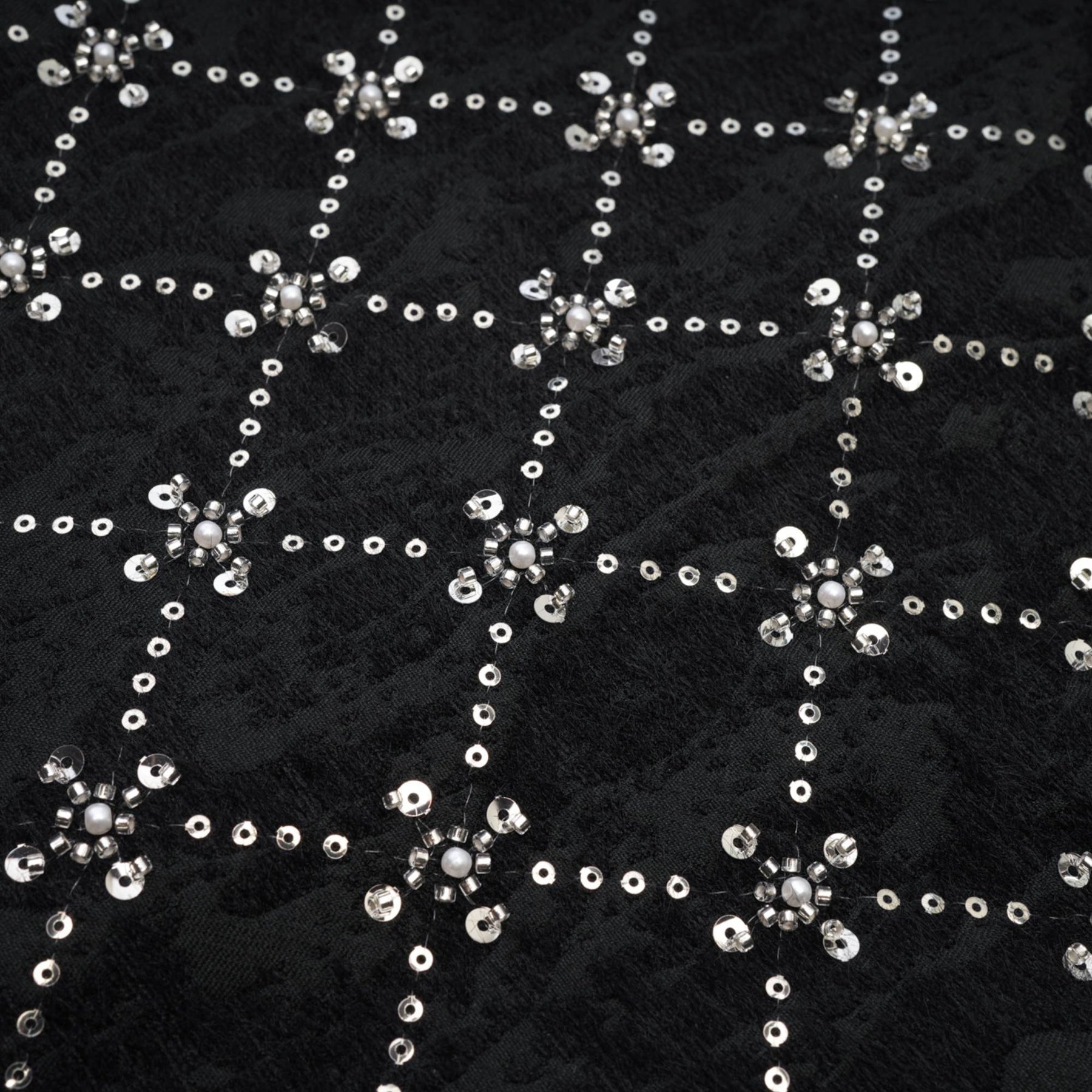 Black sleeveless dress with rear zipper and shiny crystal embellishments % polyester composition