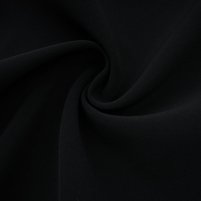 Black mini dress with faux pearl embellishments called Danae