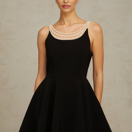 Black mini dress with faux pearl embellishments called Danae