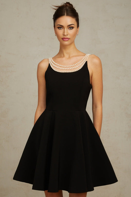 Black mini dress with faux pearl embellishments called Danae
