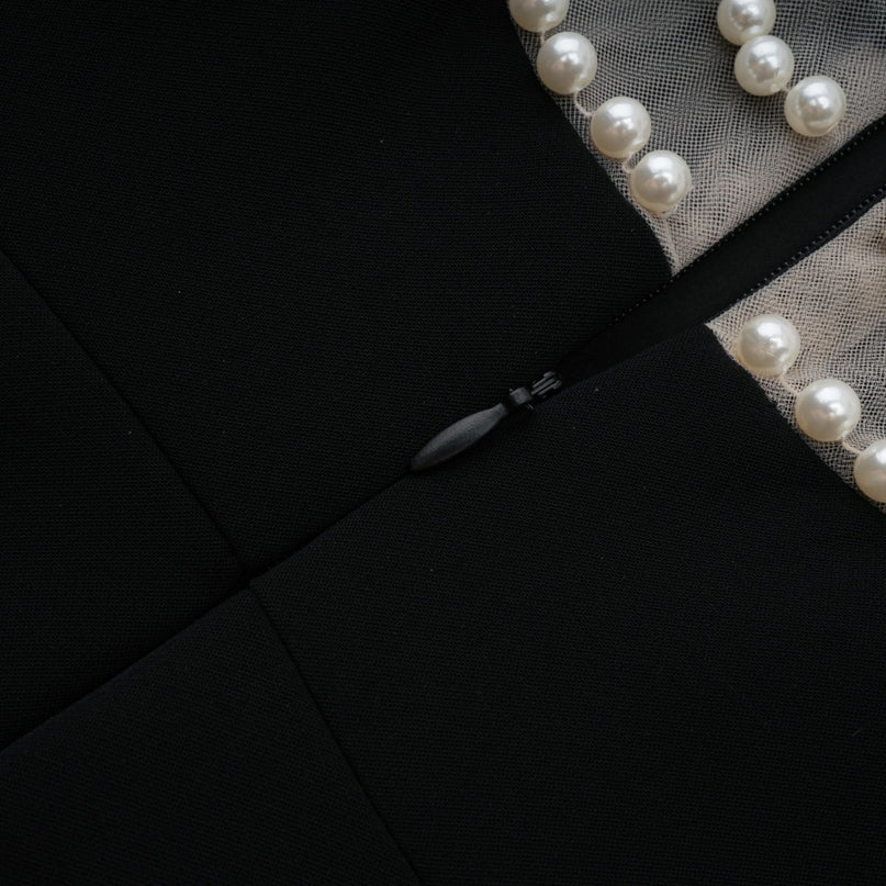 Black mini dress with faux pearl embellishments named Danae