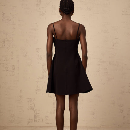 Black mini dress with flared skirt and rose applique details