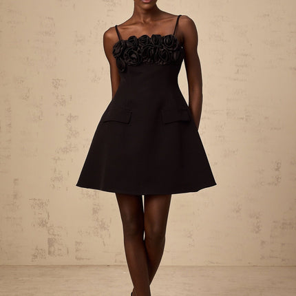 Black mini dress with flared skirt and rose applique details
