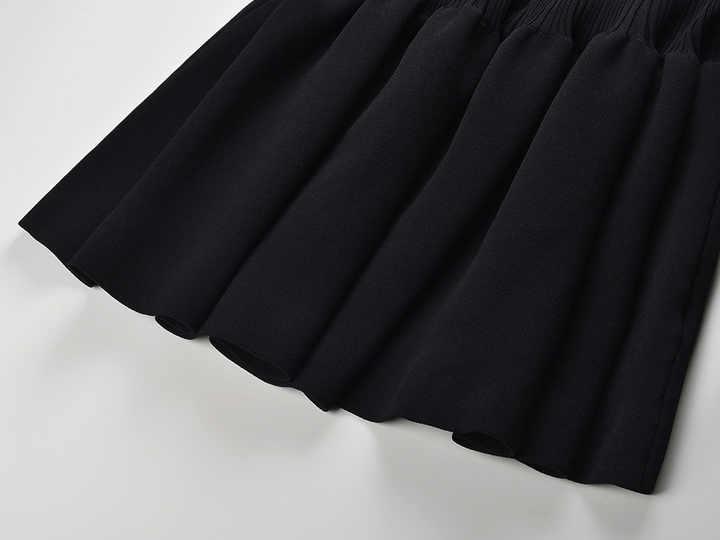 Black off-shoulder bodycon dress with bow detail and flared bottom