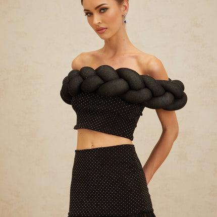 Black off the shoulder cropped top with braid detailing and rhinestone embellishment