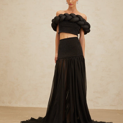 Black off the shoulder cropped top with braid detailing and rhinestone embellishment