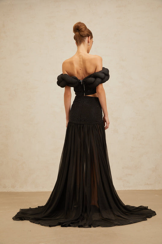 Black off the shoulder cropped top with braid detailing and rhinestone embellishment