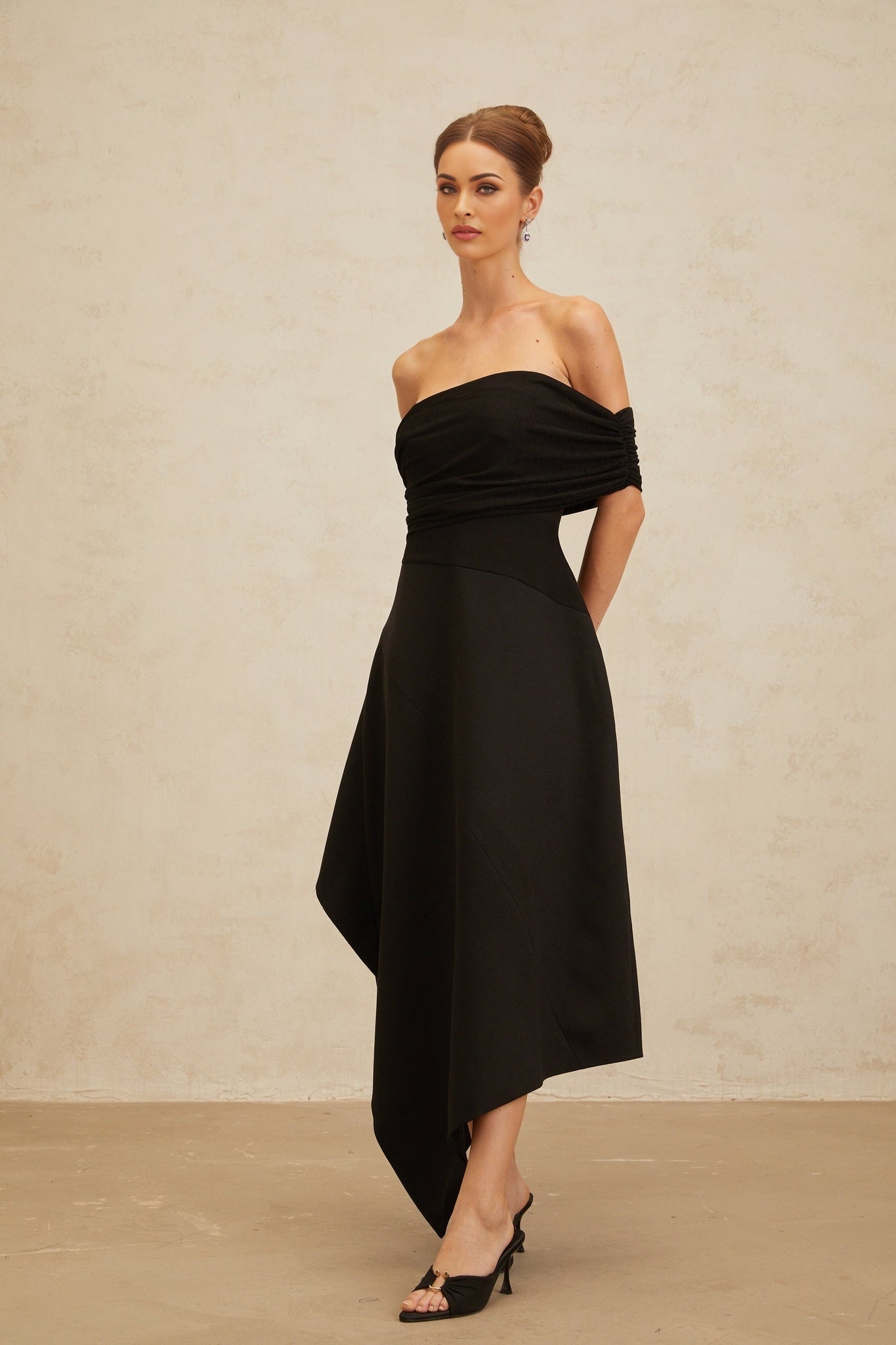 Black off the shoulder maxi dress with cinched waist and ruched detailing