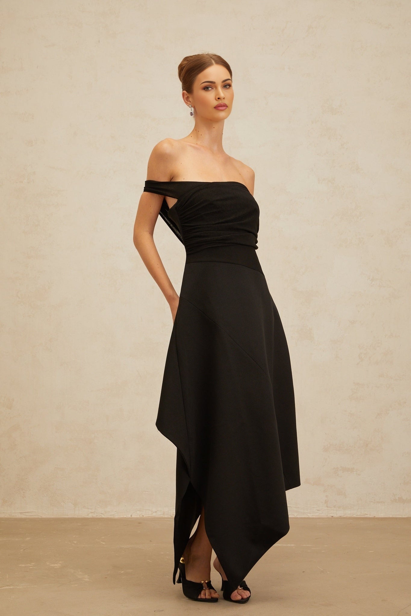 Black off the shoulder maxi dress with cinched waist and ruched detailing