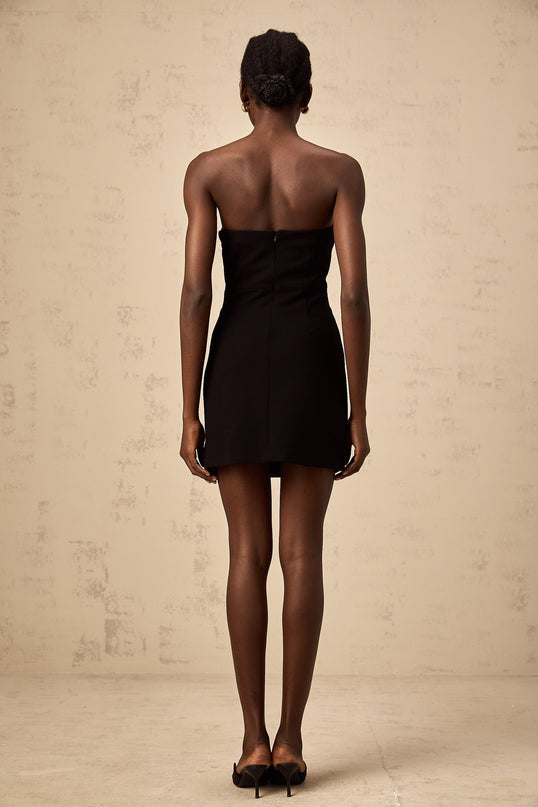 Black off shoulder mini dress with feather embellishments