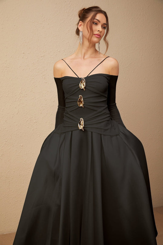 Black offshoulder maxi dress with panelled design worn by model