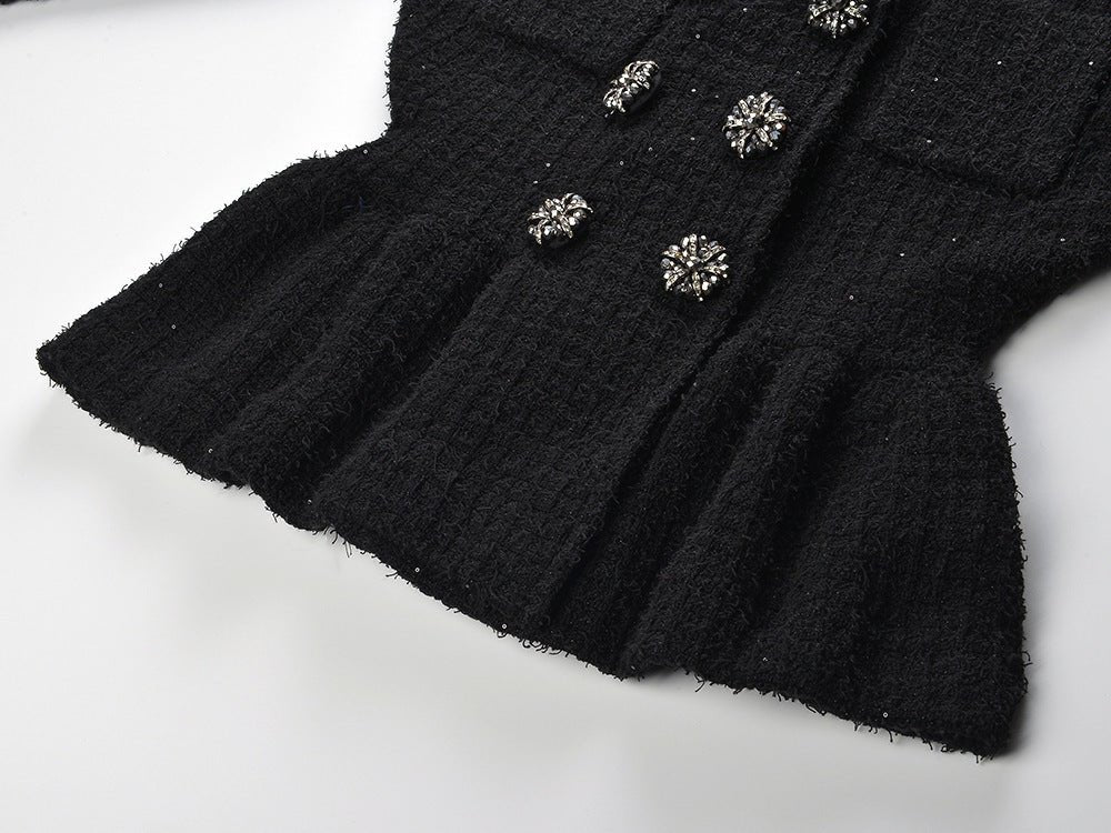 Black peplum jacket and skirt ensemble with decorative buttons on pockets