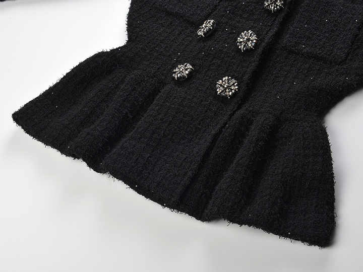 Black peplum silhouette jacket and skirt ensemble with decorative buttons on pockets