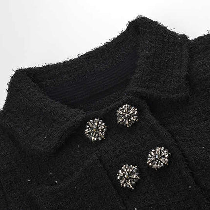 Black peplum top and fitted skirt ensemble with decorative buttons and pockets