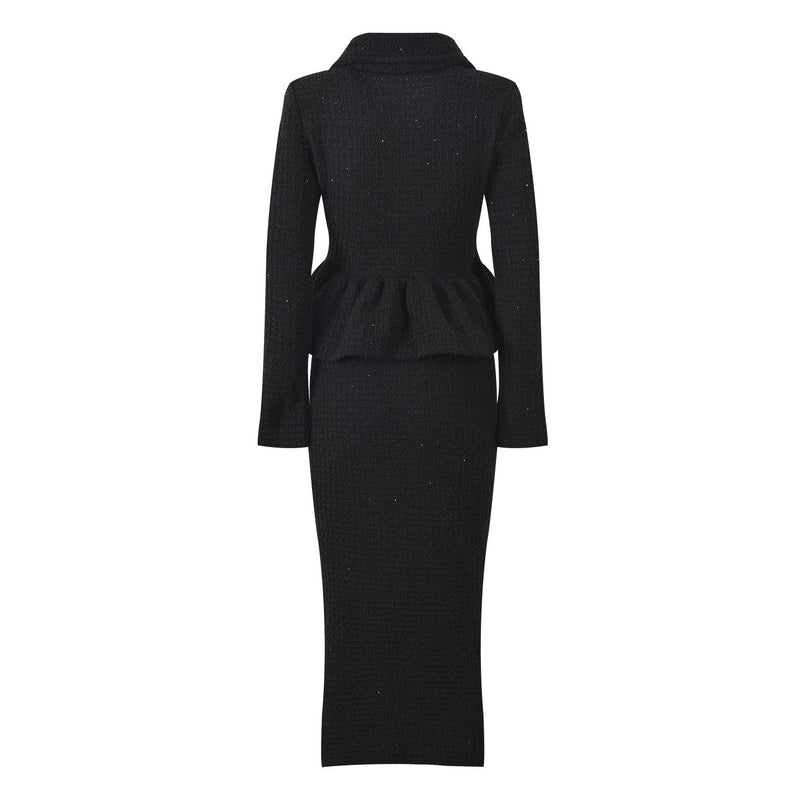 Black peplum top and fitted skirt ensemble with decorative buttons and pockets