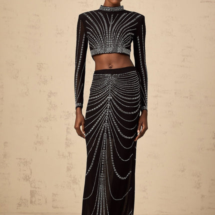 Black rhinestone mesh top and skirt set with matching pieces featuring sparkly embellishments on sheer fabric