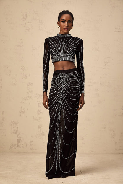Black rhinestone mesh top and skirt set with matching pieces featuring sparkly embellishments on sheer fabric