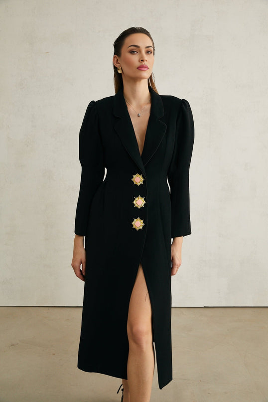 Black single breasted long coat by Aelle