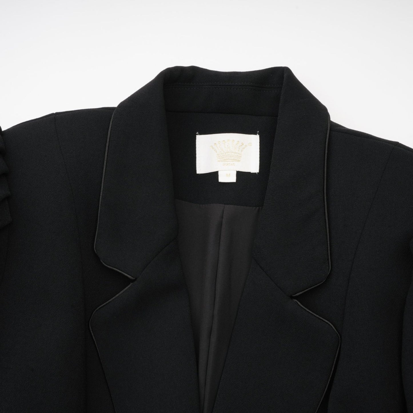 Black single breasted long coat by Aelle