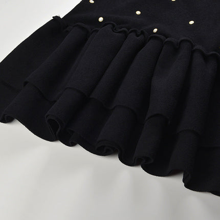 Black sleeveless dress with pearl embellishments and ruffle hem