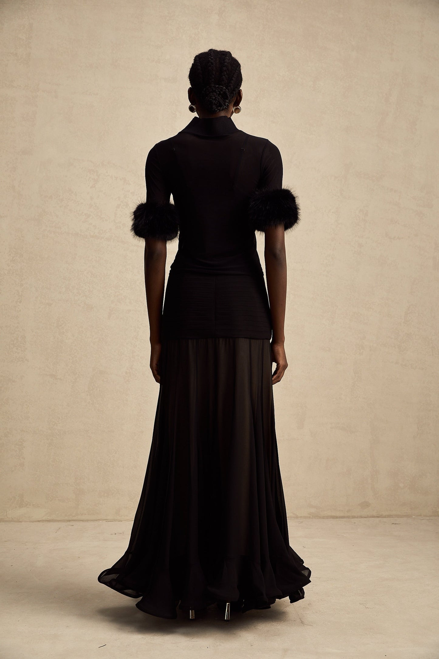 Black sleeveless top with faux fur bodice and sheer tulle overlay