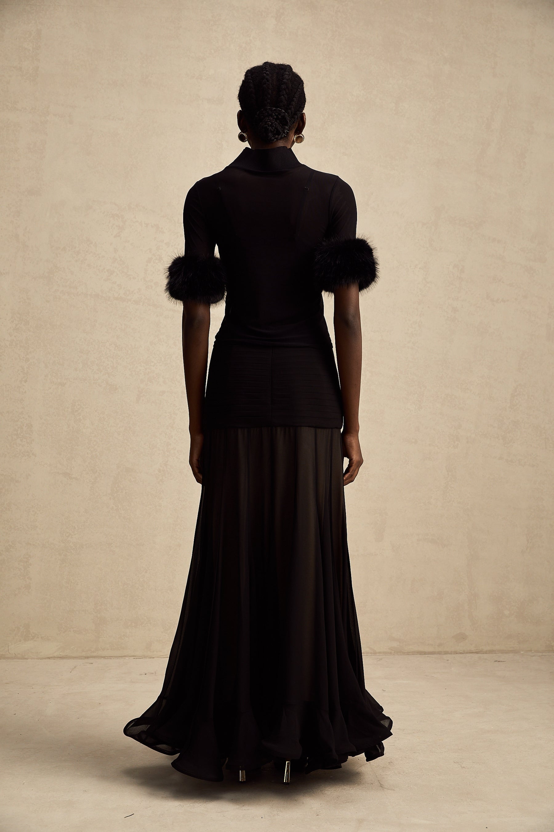 Black sleeveless top with faux fur bodice and sheer tulle overlay