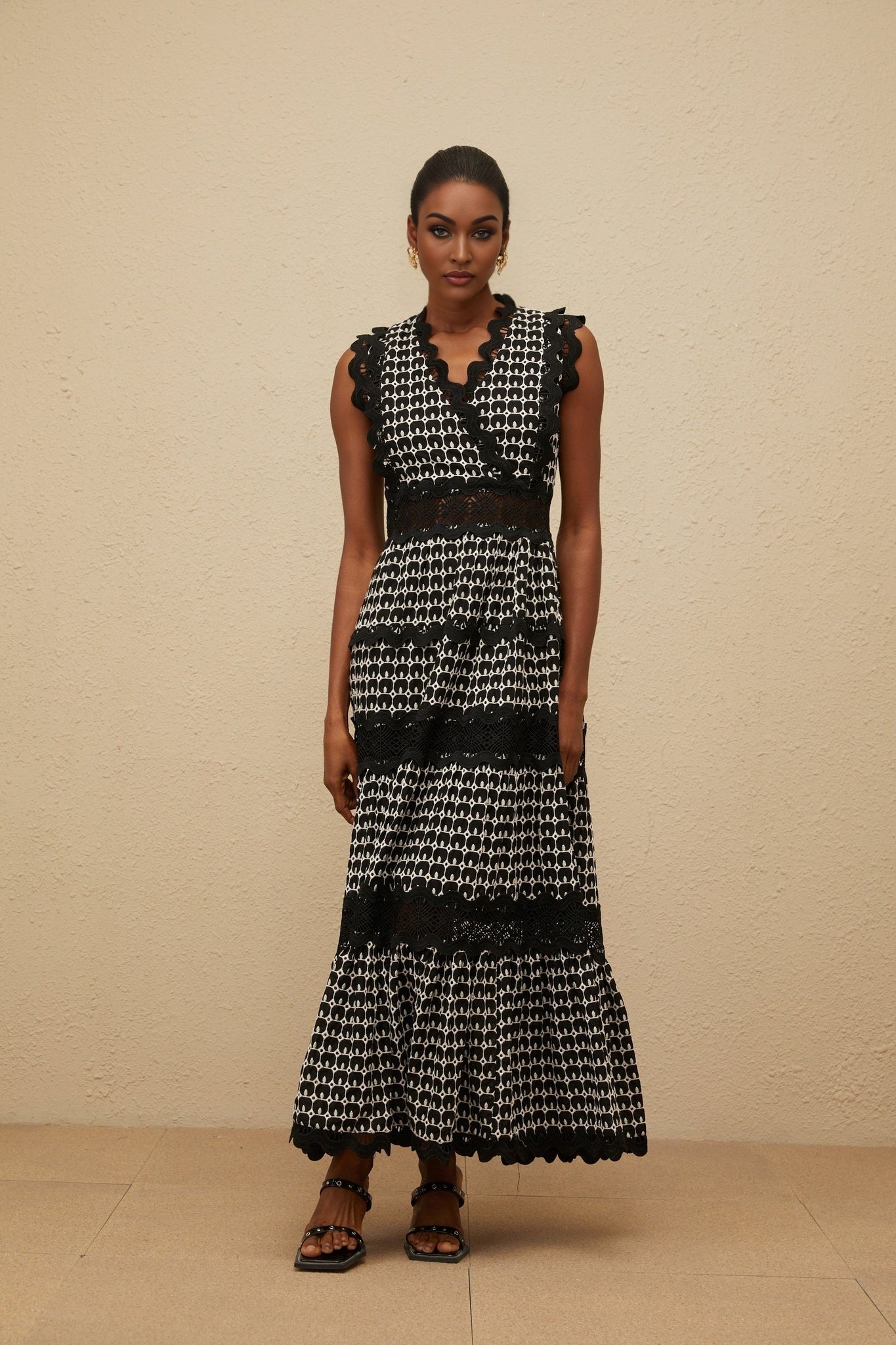 Black Sleeveless V-Neck Maxi Dress with Cut-out Design and Lace Panelling