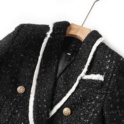 Black tailored blazer with shorts double-breasted belted waist white accents structured fitted silhouette chic sophisticated look spring fall tweed fabric texture gold-tone buttons trim semi-formal events modern twist classic styles