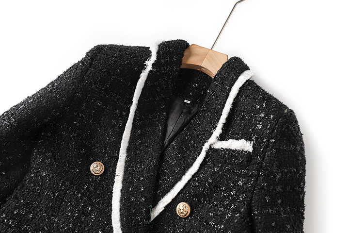 Black tailored blazer with shorts double-breasted belted waist white accents structured fitted silhouette chic sophisticated look spring fall tweed fabric texture gold-tone buttons trim semi-formal events modern twist classic styles
