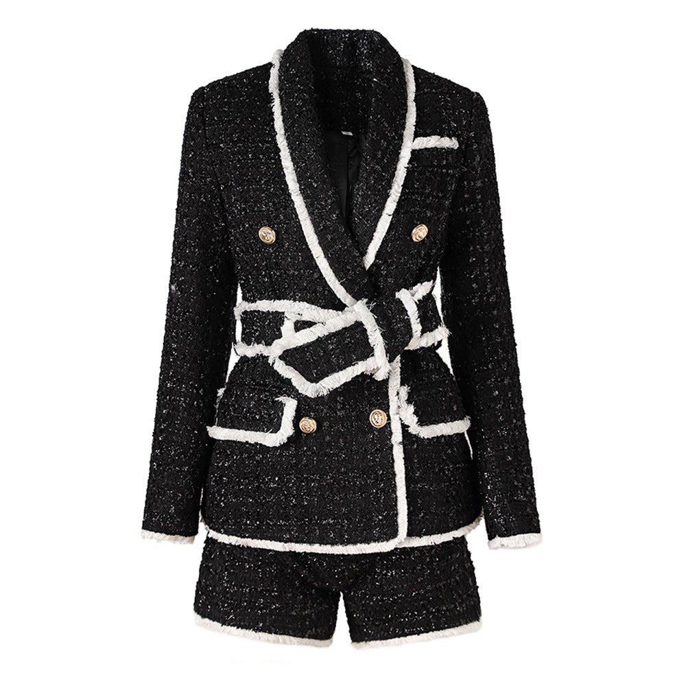 Black tailored blazer with shorts double-breasted belted waist white accents structured fitted silhouette tweed fabric gold-tone buttons trim chic sophisticated look modern twist classic styles semi-formal events spring fall