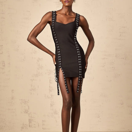 Black tightfitting mini dress with hookandeye closure and bandage style design