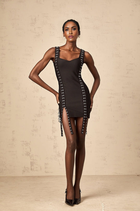 Black tightfitting mini dress with hookandeye closure and bandage style design