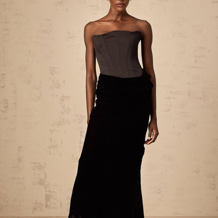 Black velvet off shoulder floor length dress with fitted bodice and flowing skirt