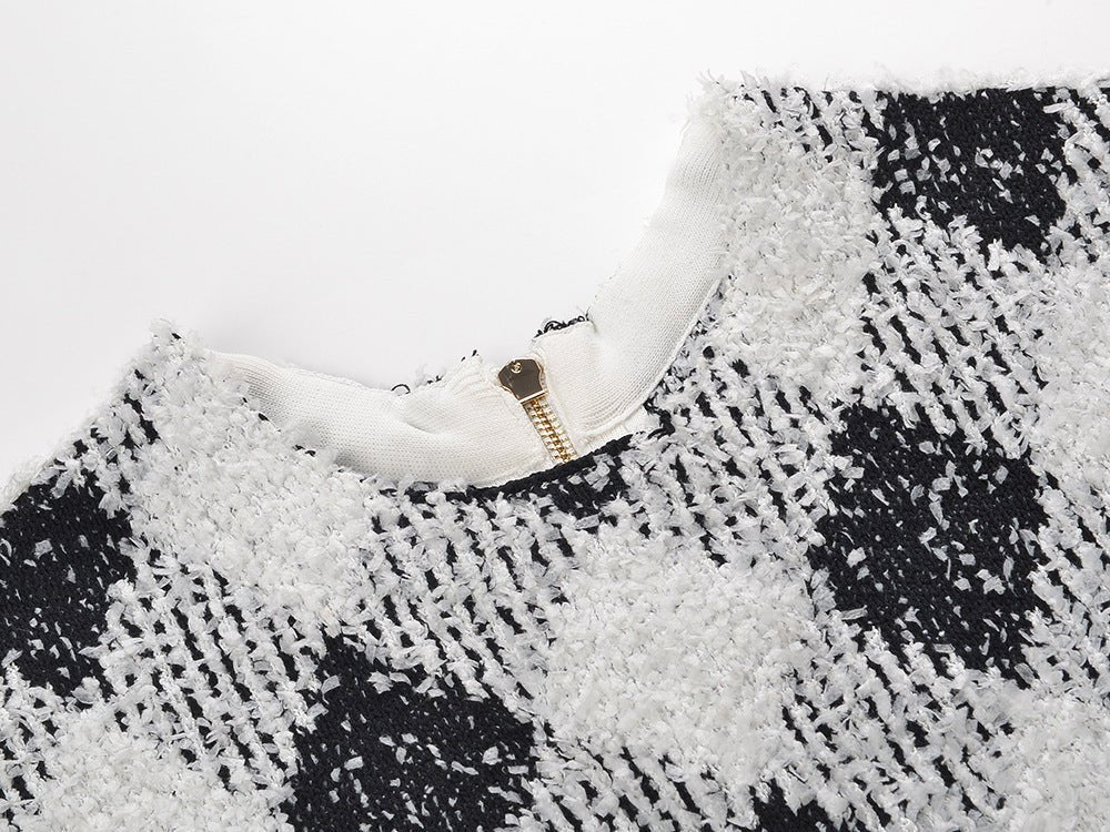 Black and white argyle pattern bodycon dress with pockets and golden button accents