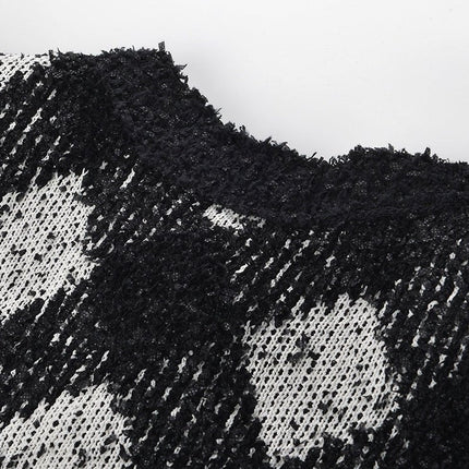 Black and white argyle knit cropped cardigan with gold-tone buttons