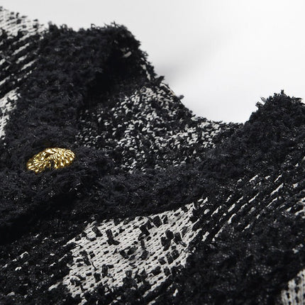 Black and white argyle knit cropped jacket with gold-tone buttons