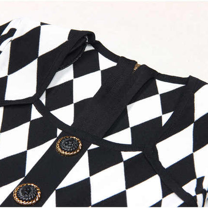 Black and white geometric harlequin pattern fitted dress with gold decorative buttons
