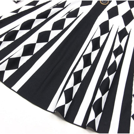 Black and white geometric harlequin pattern fitted dress with gold decorative buttons