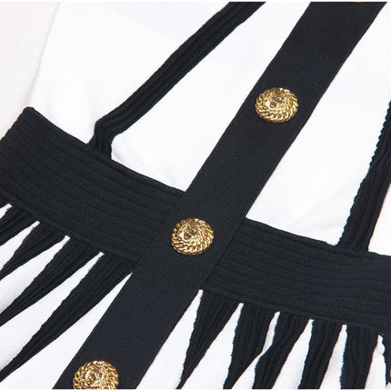 Black and white A-line dress with gold accents and rose embellishment