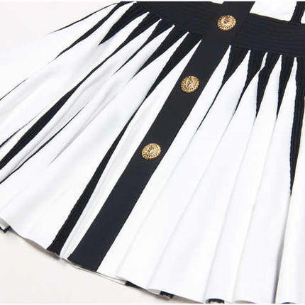 Black and white halter neck A-line dress with gold accents and rose embellishment