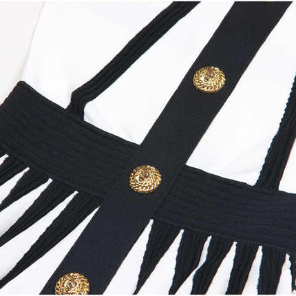 Black and white halter neck A-line dress with gold accents and rose embellishment