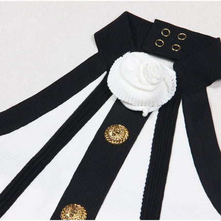 Black and white halter neck A-line dress with gold accents