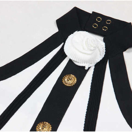 Black and white halter neck pleated skirt with gold accents