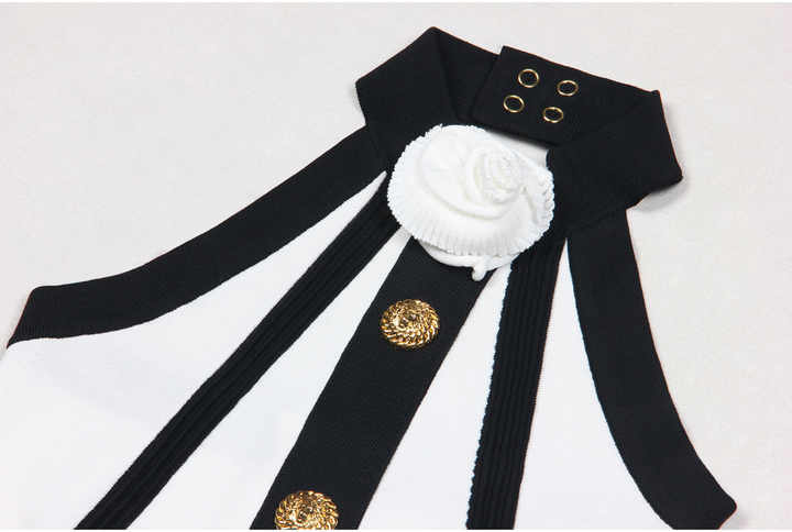 Black and white halter neck pleated skirt with gold accents