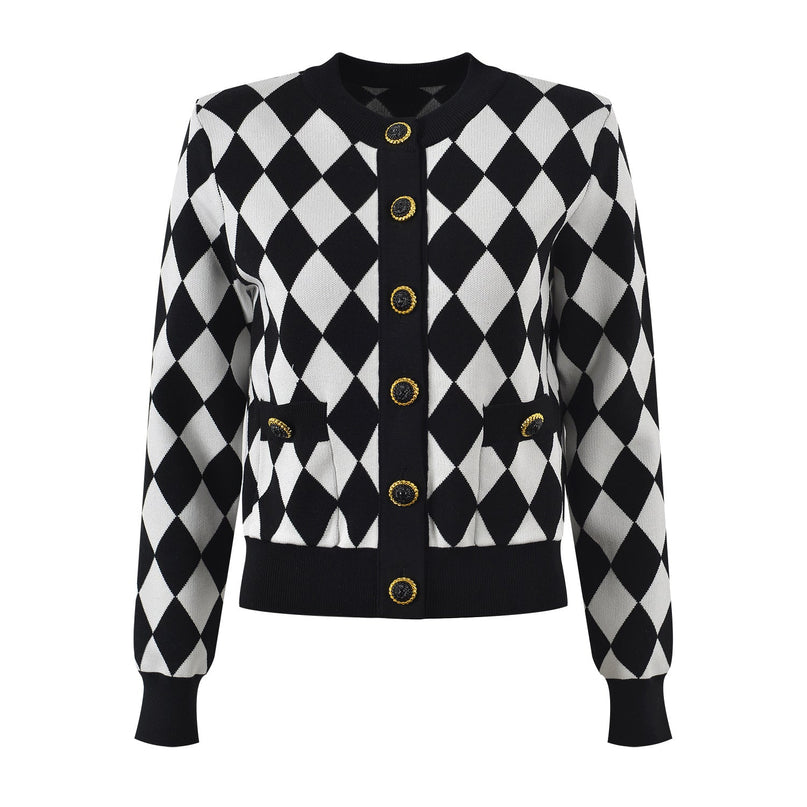 Black and white harlequin pattern cardigan with gold button accents and pockets