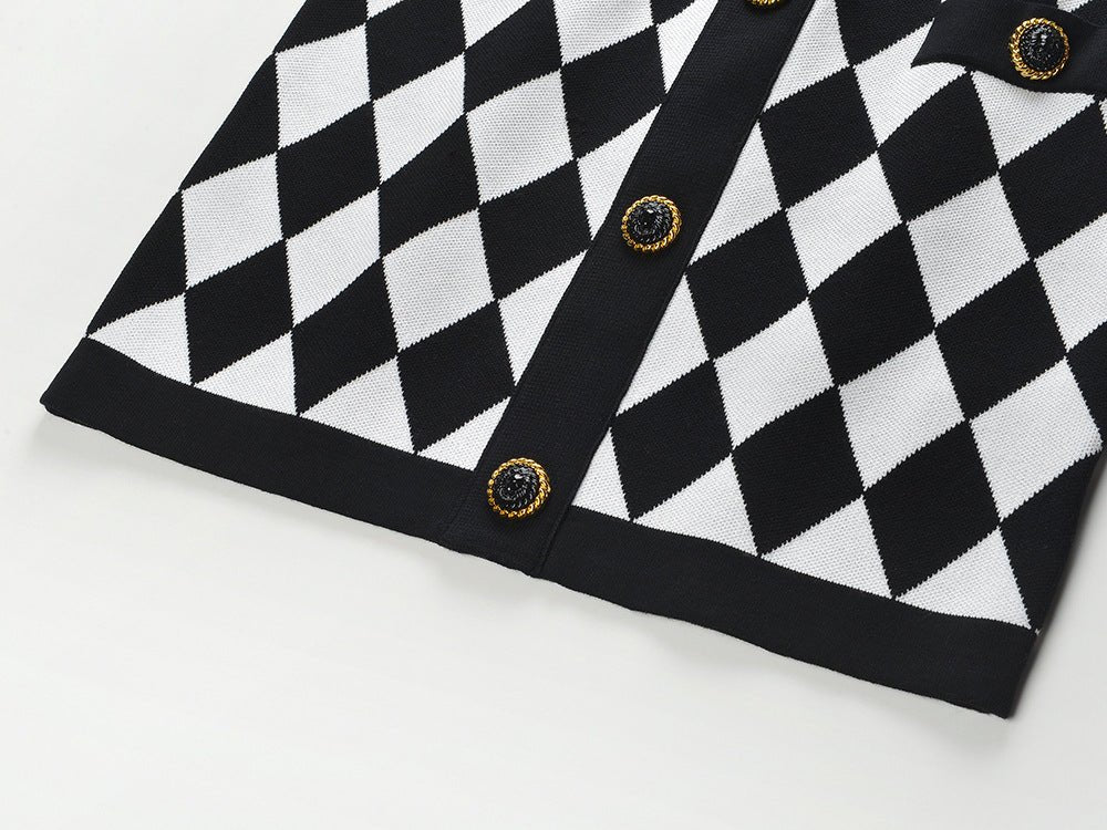 Black and white harlequin pattern pencil skirt with gold-button accents