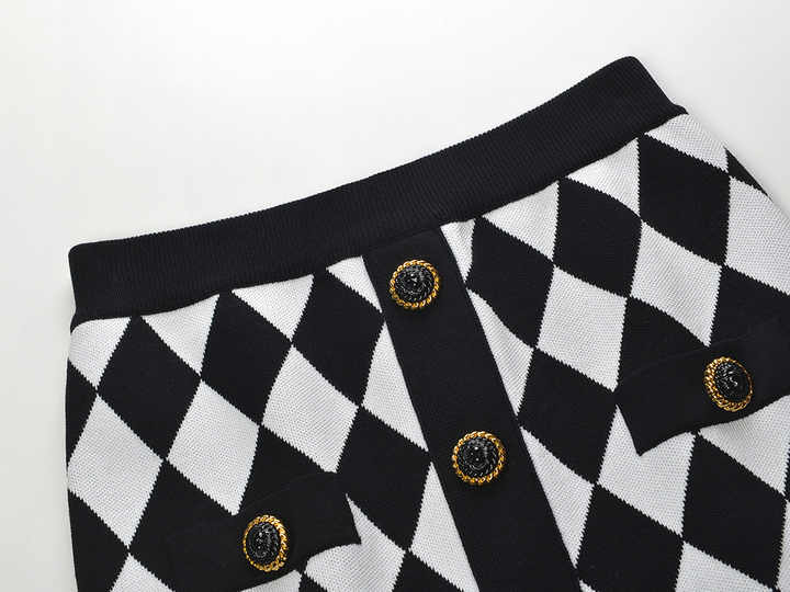 Black and white harlequin pattern pencil skirt with gold-button accents