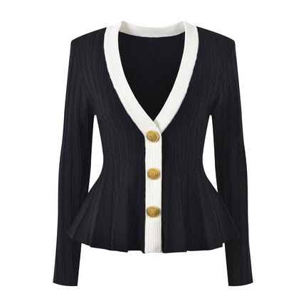 Black and white peplum style top with gold button embellishments